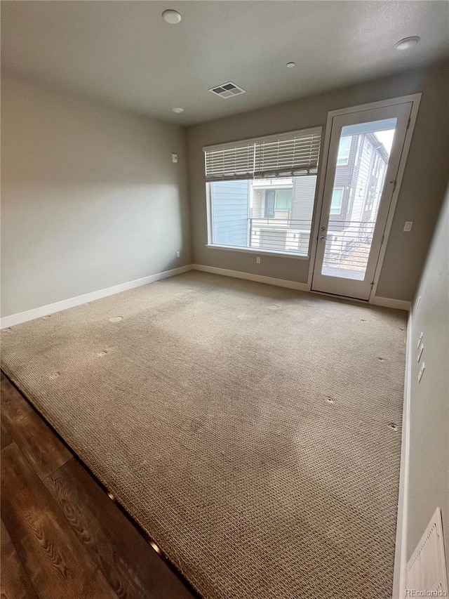 16841 Askins Loop Unit 208, Parker, CO 80134 - carpeted empty room featuring baseboards and visible vents