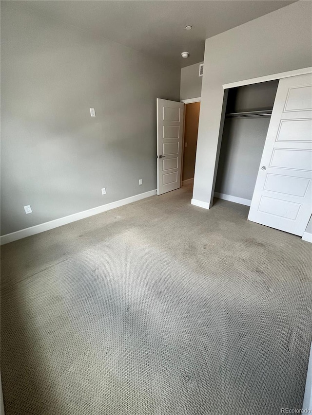 16841 Askins Loop Unit 208, Parker, CO 80134 - unfurnished bedroom with baseboards, carpet, and a closet