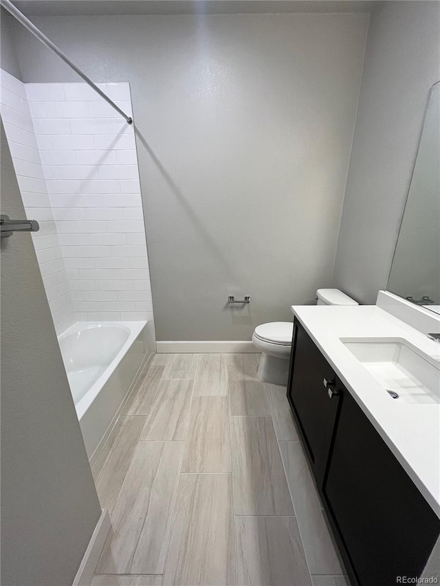 16841 Askins Loop Unit 208, Parker, CO 80134 - bathroom with vanity, baseboards, toilet, and bathing tub / shower combination