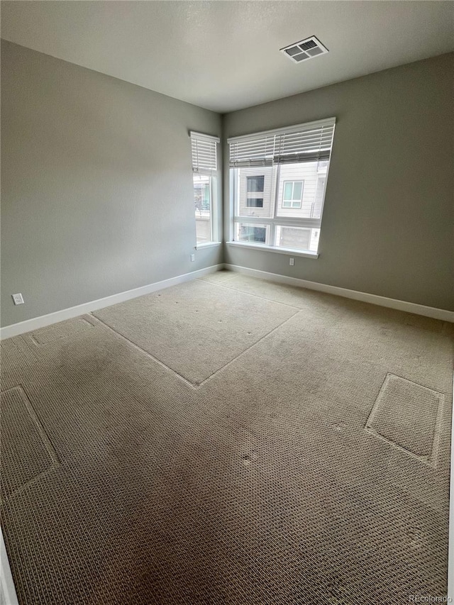 16841 Askins Loop Unit 208, Parker, CO 80134 - carpeted spare room featuring baseboards and visible vents