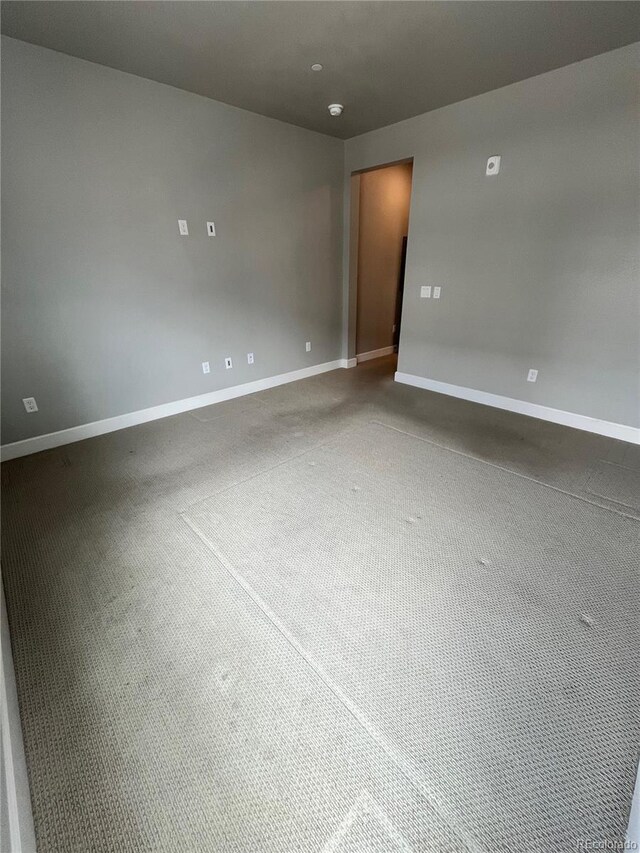16841 Askins Loop Unit 208, Parker, CO 80134 - unfurnished room with baseboards and carpet