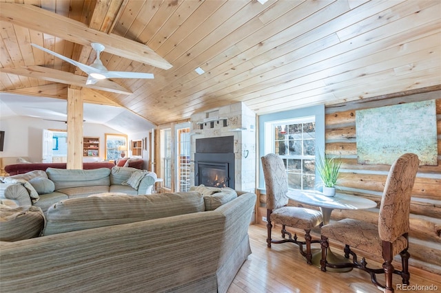 9185 US Highway 285, Salida, CO 81201 - living room with wooden ceiling, vaulted ceiling, light wood-style flooring, a large fireplace, and log walls
