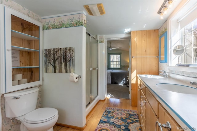 9185 US Highway 285, Salida, CO 81201 - ensuite bathroom with hardwood / wood-style flooring, double vanity, and a shower stall