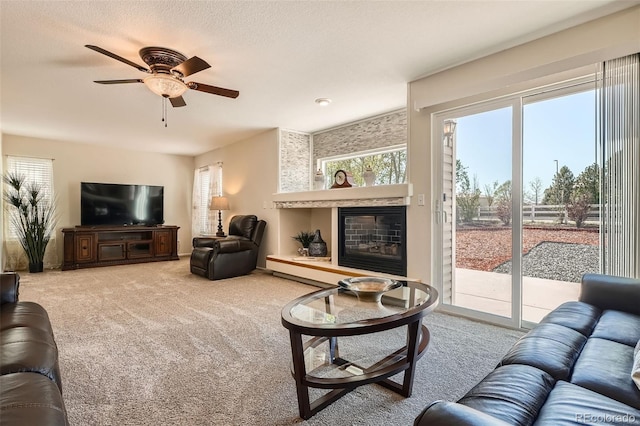20336 E 48th Dr, Denver, CO 80249 - living room with carpet flooring, a glass covered fireplace, and ceiling fan