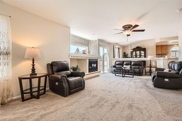 20336 E 48th Dr, Denver, CO 80249 - carpeted living room with ceiling fan, a tile fireplace, and baseboards