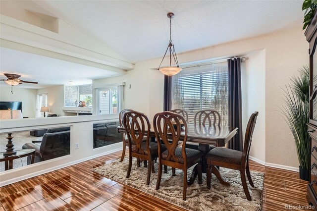 20336 E 48th Dr, Denver, CO 80249 - dining room with wood finished floors, a ceiling fan, baseboards, and lofted ceiling