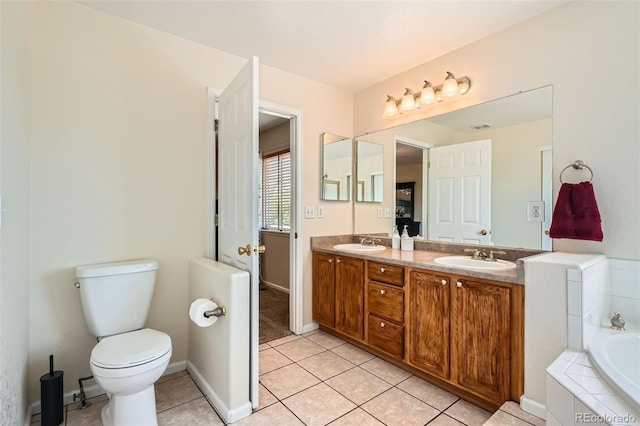 20336 E 48th Dr, Denver, CO 80249 - bathroom featuring double vanity, tile patterned floors, a garden tub, and toilet