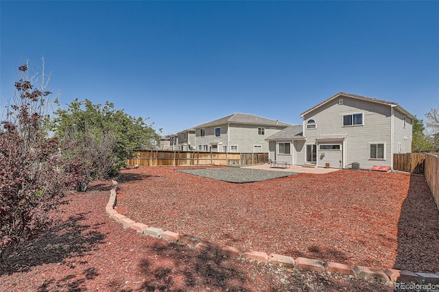 20336 E 48th Dr, Denver, CO 80249 - rear view of house with a patio and a fenced backyard