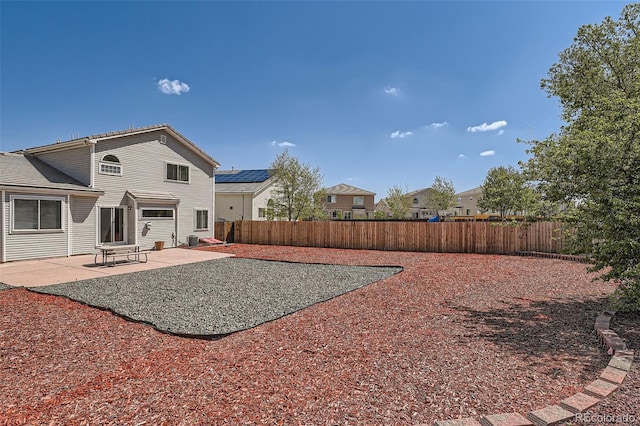 20336 E 48th Dr, Denver, CO 80249 - back of house featuring a patio, a fenced backyard, and cooling unit