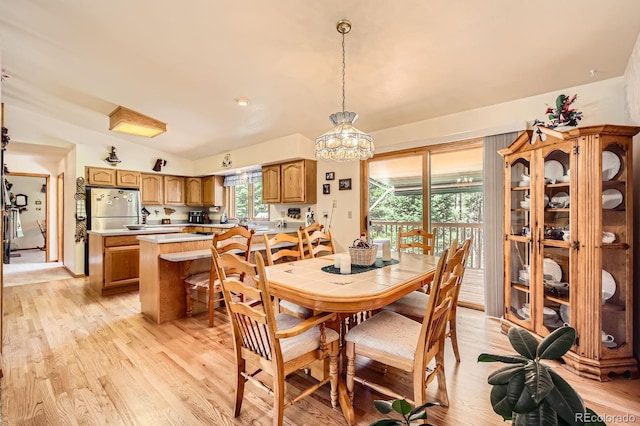 18150 Martingale Rd, Monument, CO 80132 - dining area featuring light wood finished floors and vaulted ceiling