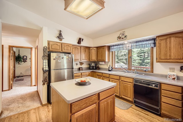18150 Martingale Rd, Monument, CO 80132 - kitchen with dishwasher, freestanding refrigerator, a sink, vaulted ceiling, and light wood-style floors