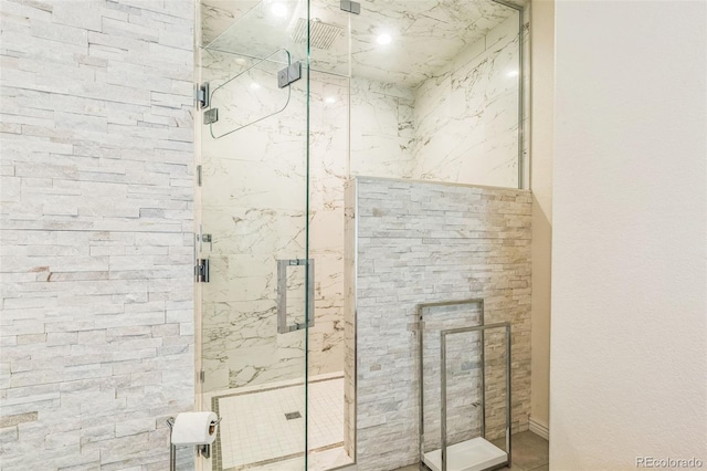 full bath with a marble finish shower