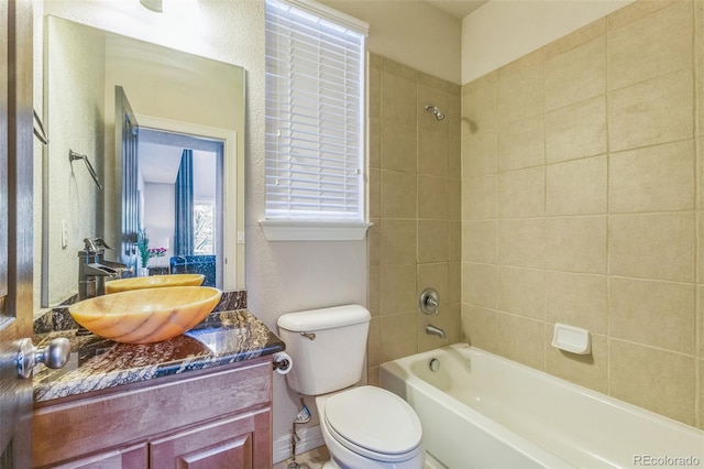 full bathroom with toilet, vanity, and shower / bathing tub combination
