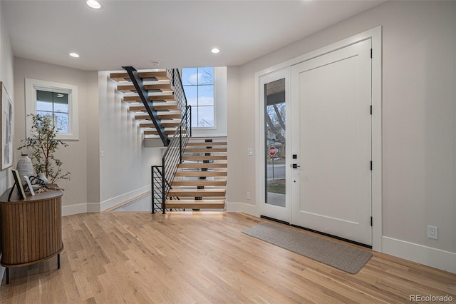 entrance foyer featuring plenty of natural light and light wood-type flooring