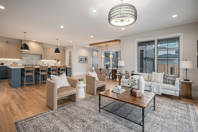 living room with light hardwood / wood-style flooring