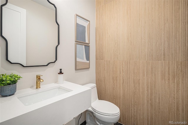 bathroom with toilet and sink