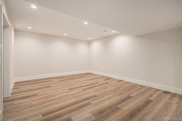 spare room featuring light wood-type flooring