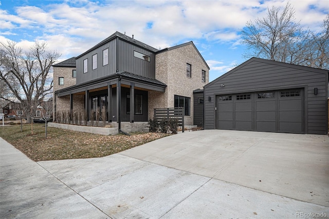 view of front of property with a porch and a garage