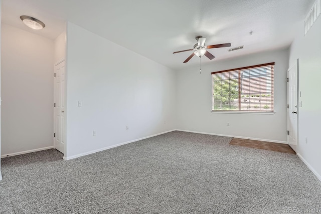 2705 S Danube Way Unit 110, Aurora, CO 80013 - unfurnished room featuring a ceiling fan, carpet flooring, and baseboards