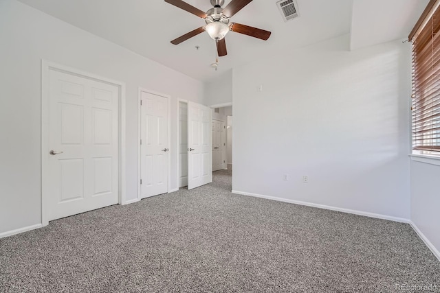 2705 S Danube Way Unit 110, Aurora, CO 80013 - unfurnished bedroom with carpet floors, baseboards, and ceiling fan