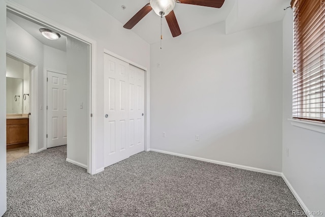 2705 S Danube Way Unit 110, Aurora, CO 80013 - unfurnished bedroom featuring light carpet, baseboards, a closet, and a ceiling fan