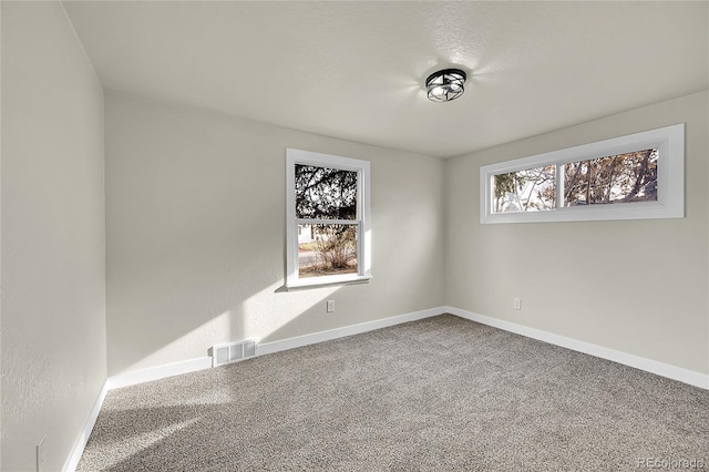 empty room featuring carpet floors