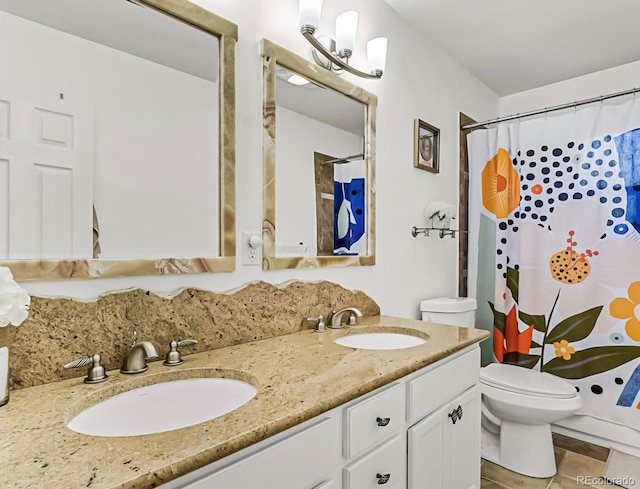 bathroom featuring vanity, toilet, curtained shower, and tile patterned flooring