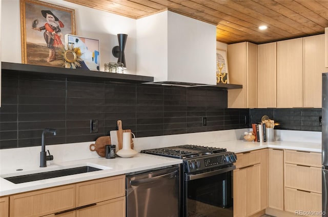 kitchen with sink, light brown cabinetry, decorative backsplash, range with gas cooktop, and stainless steel dishwasher