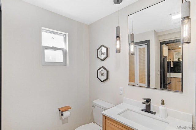 bathroom with vanity and toilet