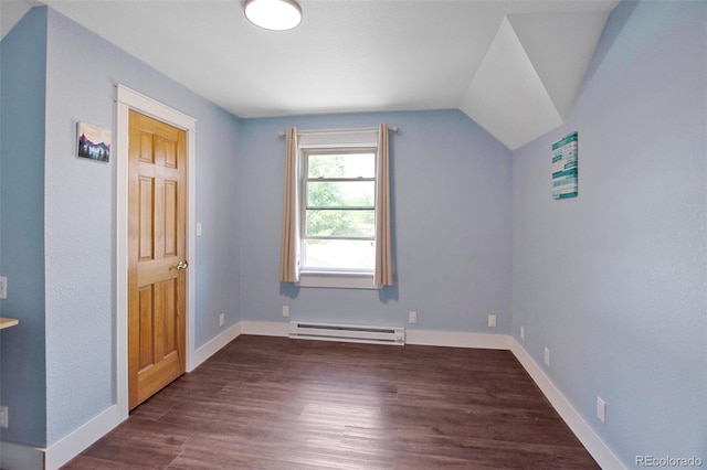 131 Faraday St, Monte Vista, CO 81144 - bonus room with baseboard heating, dark wood-type flooring, and lofted ceiling