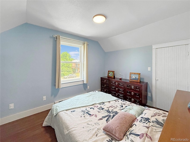131 Faraday St, Monte Vista, CO 81144 - bedroom featuring vaulted ceiling and wood finished floors