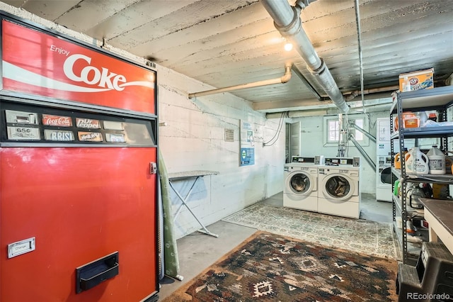 clothes washing area featuring separate washer and dryer