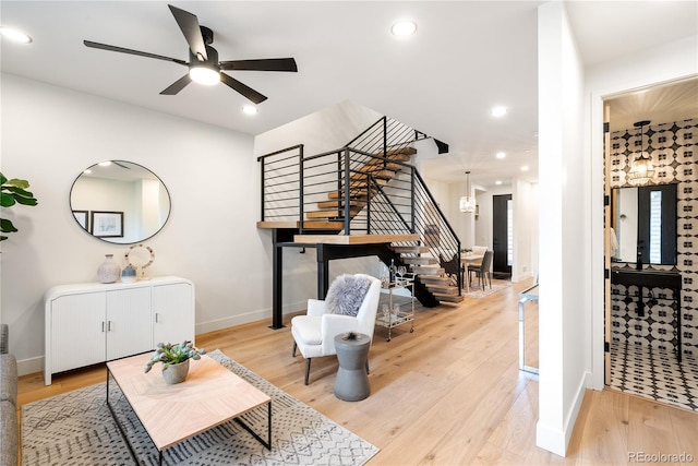 interior space featuring ceiling fan and light wood-type flooring