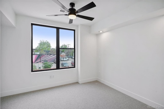 empty room with carpet floors and ceiling fan