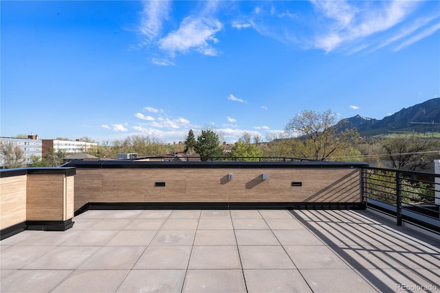 view of patio / terrace featuring a mountain view