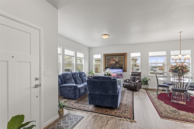 living room featuring hardwood / wood-style floors and a chandelier