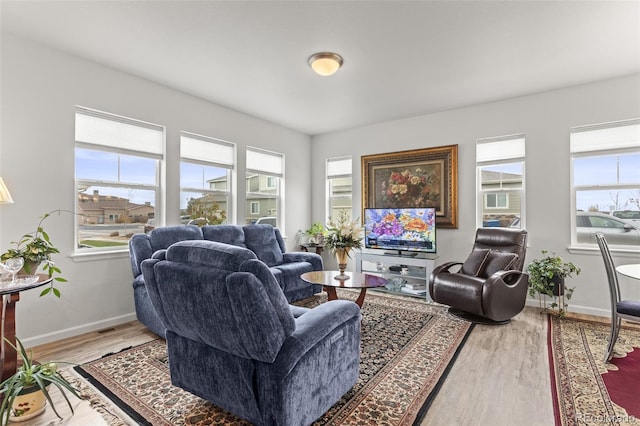 living room featuring hardwood / wood-style flooring and plenty of natural light