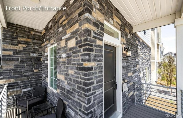4443 N Quatar Ct, Aurora, CO 80019 - entrance to property featuring a porch and stone siding