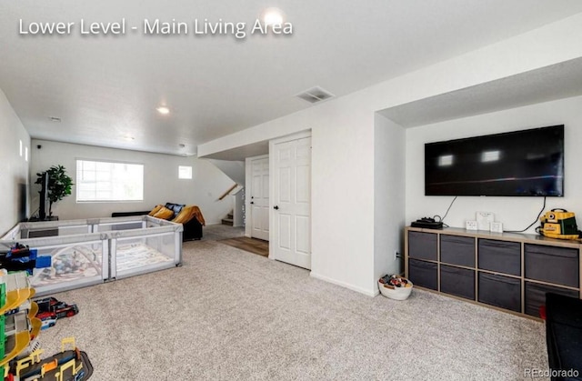 4443 N Quatar Ct, Aurora, CO 80019 - living room with stairway and carpet flooring