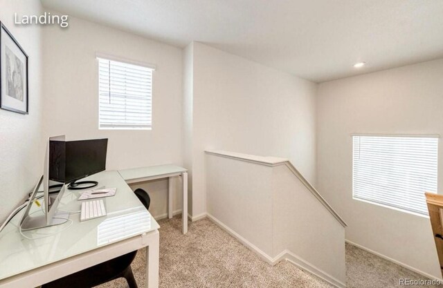 4443 N Quatar Ct, Aurora, CO 80019 - carpeted home office with baseboards