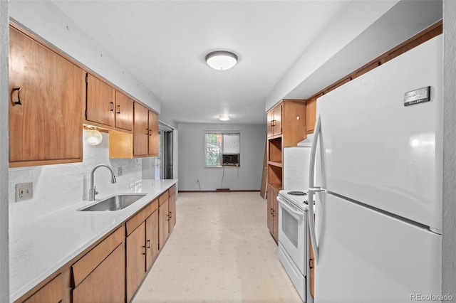 kitchen featuring white appliances, a sink, light countertops, decorative backsplash, and light floors