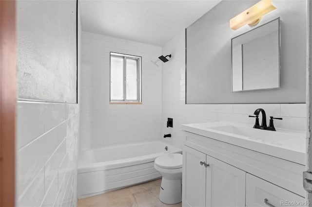 full bath featuring shower / washtub combination, tile walls, toilet, and vanity