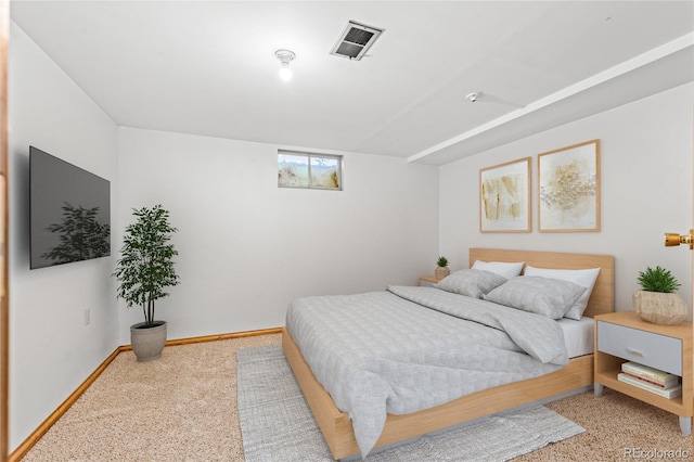 bedroom featuring visible vents and baseboards