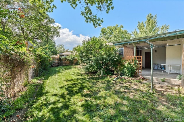 view of yard with a patio area and fence