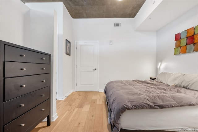 bedroom with light hardwood / wood-style floors