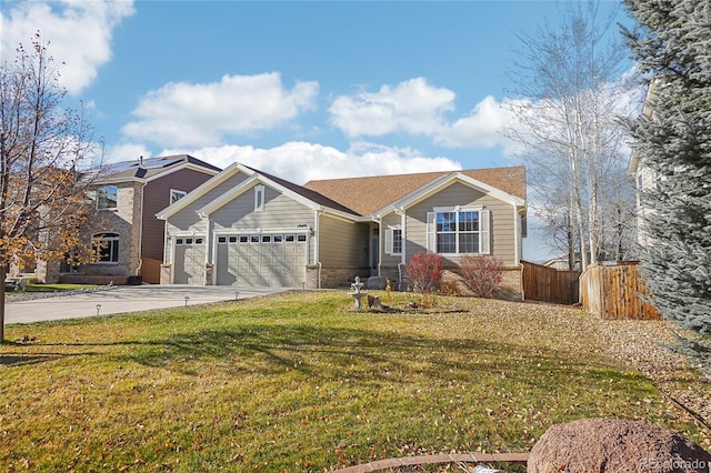 view of front of home featuring a front yard and a garage