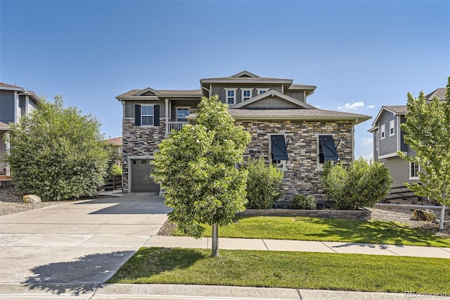 26591 E Calhoun Pl, Aurora, CO 80016 - view of front of house featuring stone siding, driveway, an attached garage, and a front yard