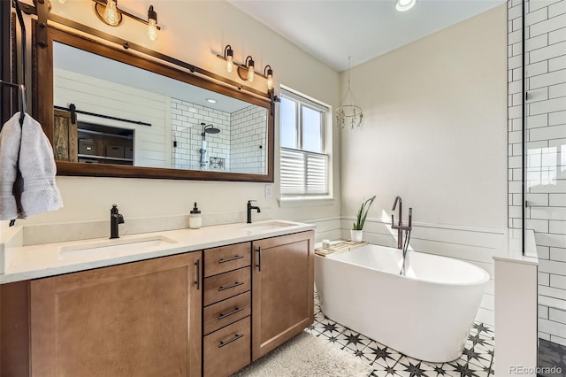 26591 E Calhoun Pl, Aurora, CO 80016 - full bath with a freestanding bath, double vanity, tiled shower, and recessed lighting
