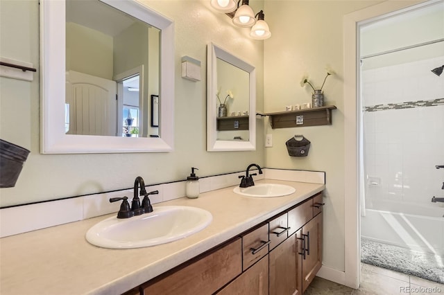 26591 E Calhoun Pl, Aurora, CO 80016 - bathroom with double vanity, bathing tub / shower combination, and tile patterned floors