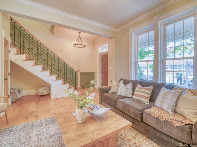 541 Fox St, Denver, CO 80204 - living room with a chandelier, ornamental molding, wood finished floors, and stairs